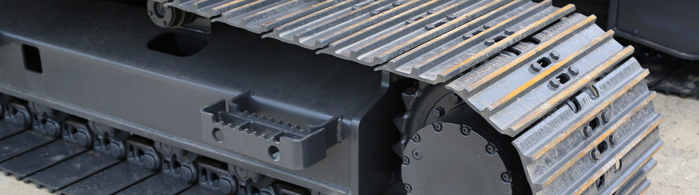 Close-up of an excavator track with ITP logo in the corner